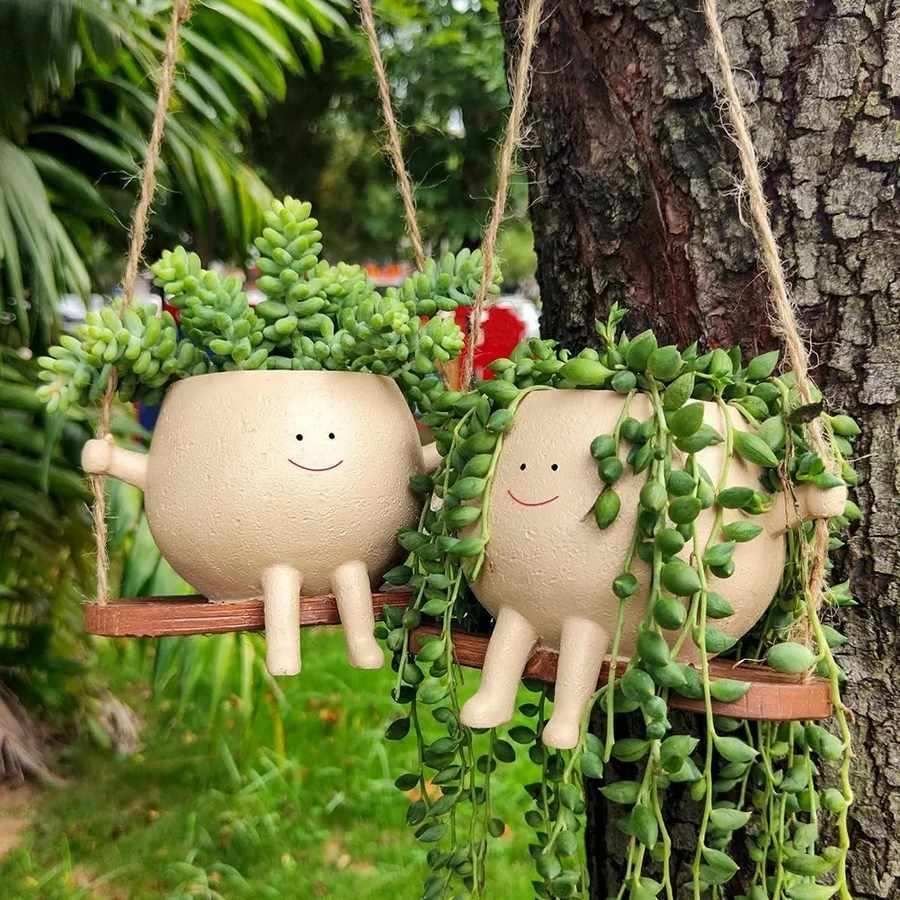 The Swinging Faces Planter